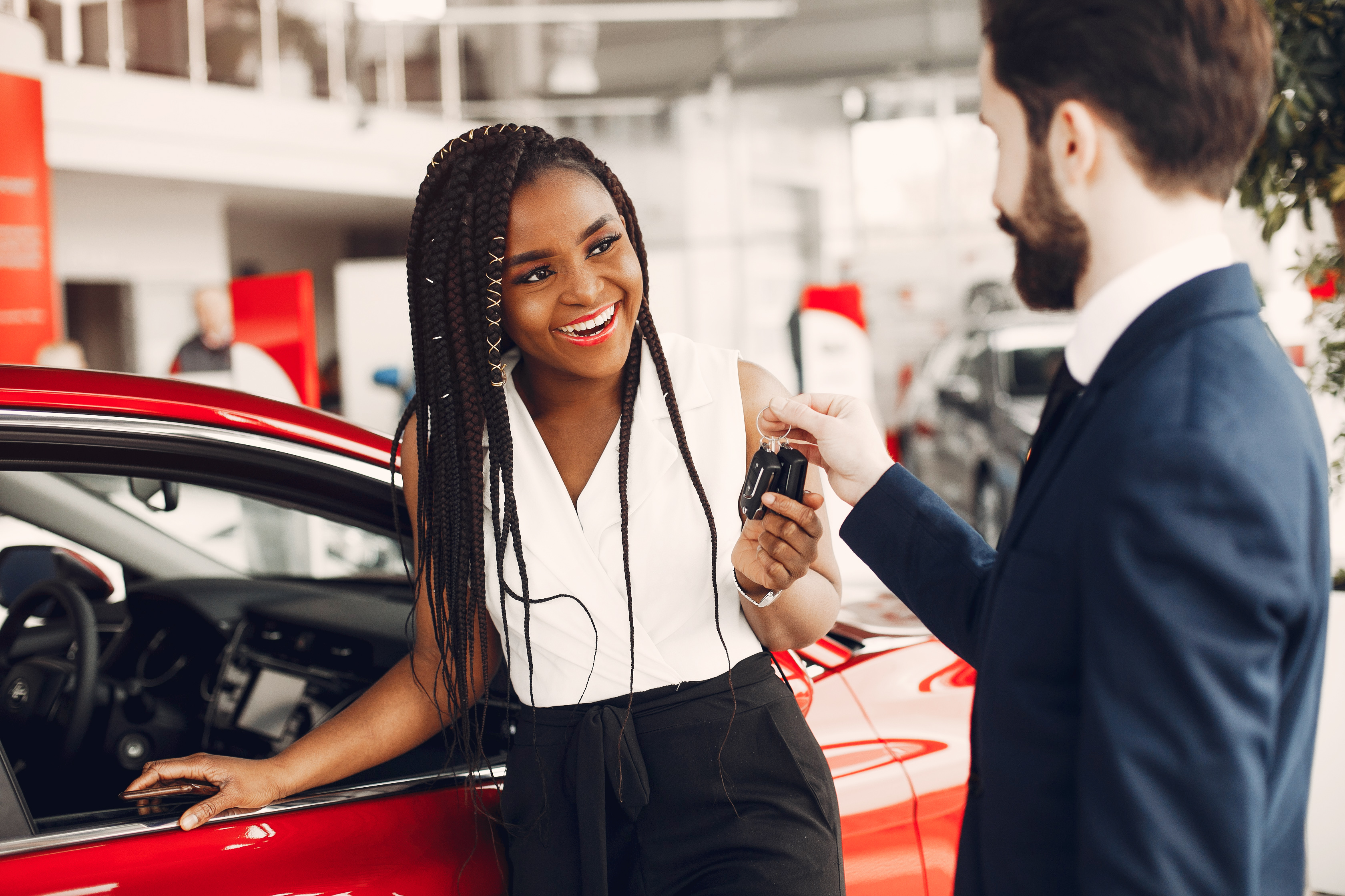 Happy car buyer with new car